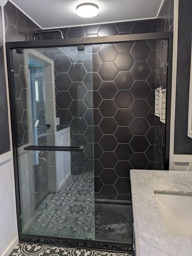 bathroom with vanity and walk in shower