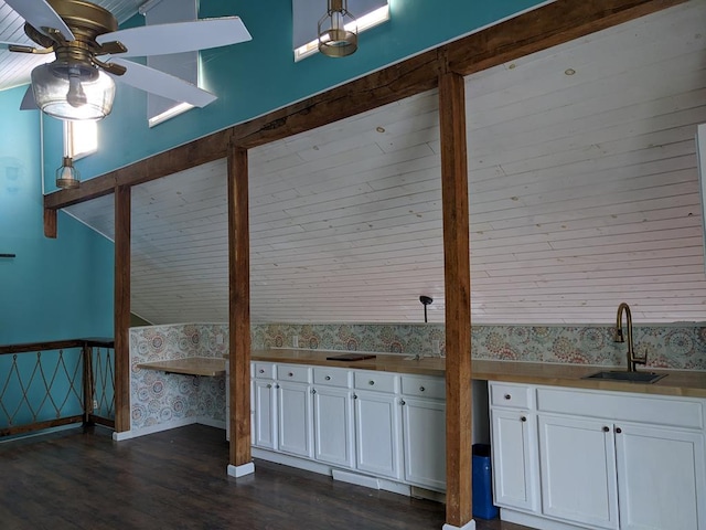 interior space with dark hardwood / wood-style flooring and sink