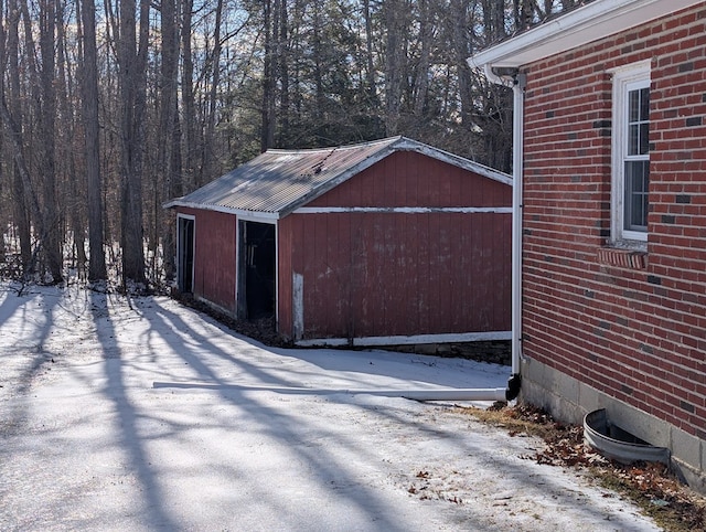 snow covered structure with an outdoor structure