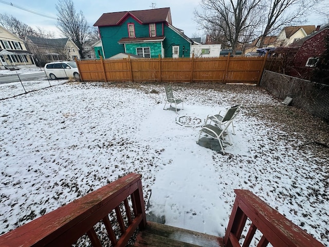 view of yard covered in snow