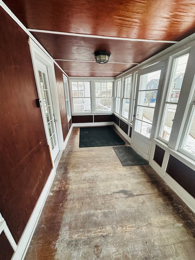 unfurnished sunroom with french doors and wood ceiling