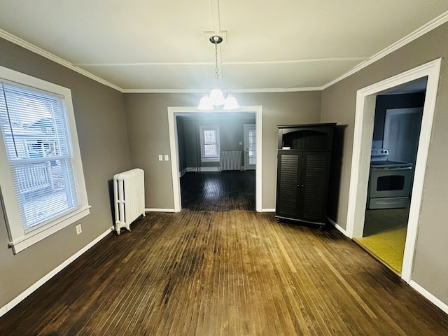 unfurnished dining area with radiator, a notable chandelier, and a healthy amount of sunlight