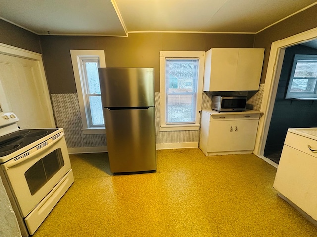 kitchen featuring white cabinetry, a wealth of natural light, and stainless steel appliances