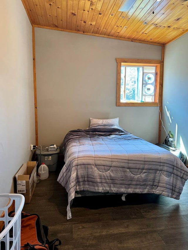 bedroom with hardwood / wood-style flooring, vaulted ceiling, crown molding, and wood ceiling