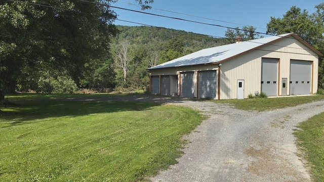 garage with a lawn