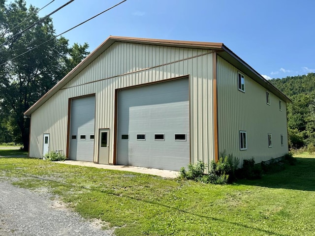 garage featuring a lawn