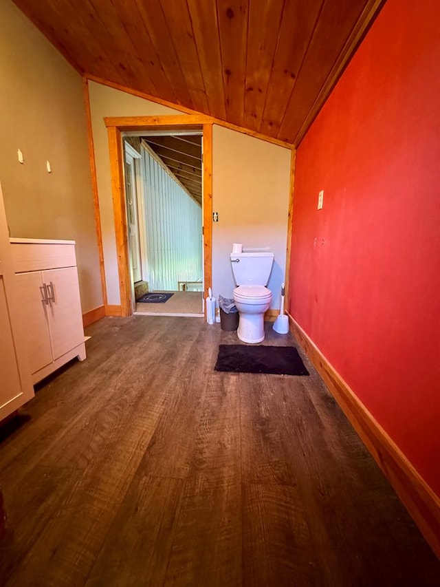 corridor with hardwood / wood-style flooring, lofted ceiling, and wood ceiling