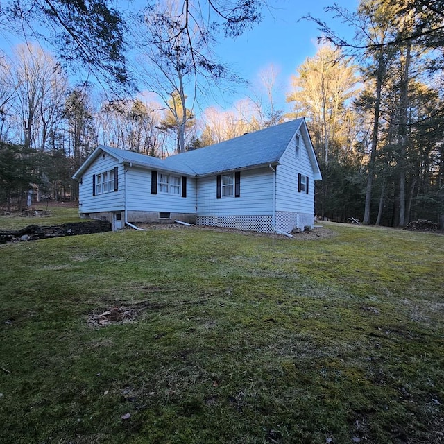 rear view of house with a lawn