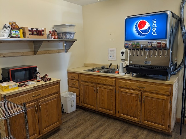 kitchen featuring dark hardwood / wood-style flooring and sink