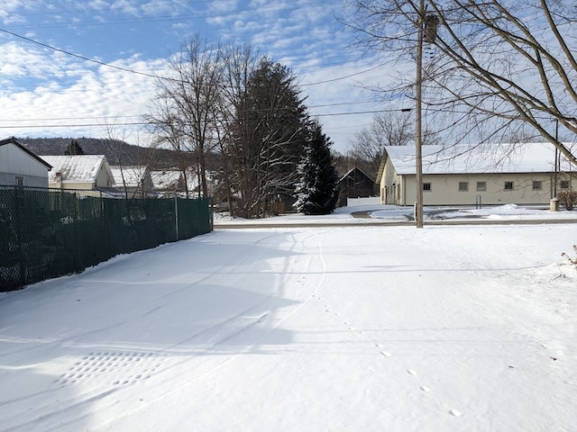 view of yard layered in snow