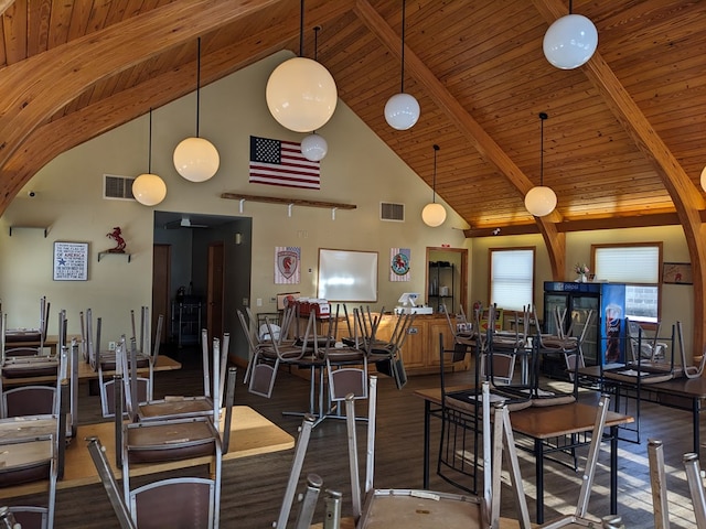 gym featuring dark hardwood / wood-style flooring, high vaulted ceiling, and wood ceiling