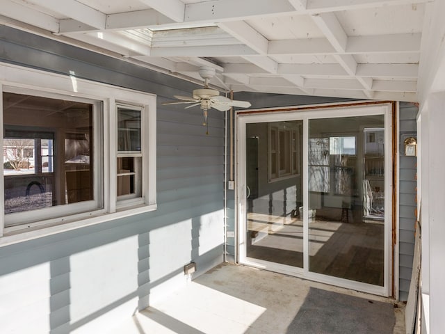 doorway to property with ceiling fan