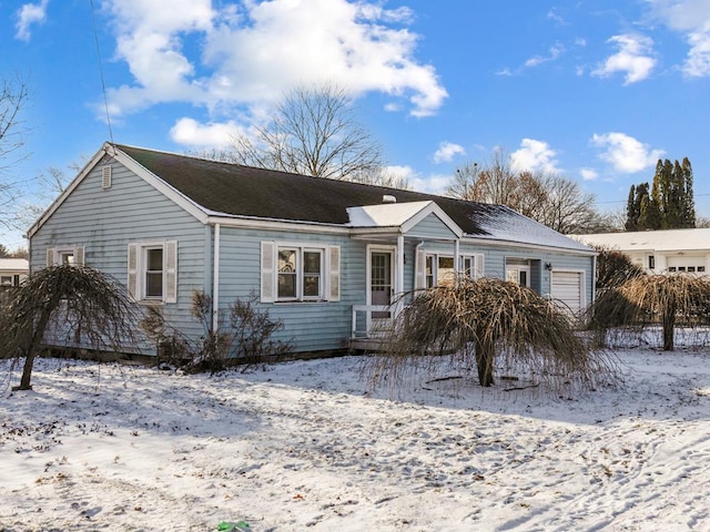 single story home featuring a garage