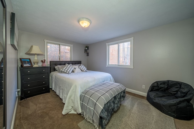 bedroom featuring dark carpet