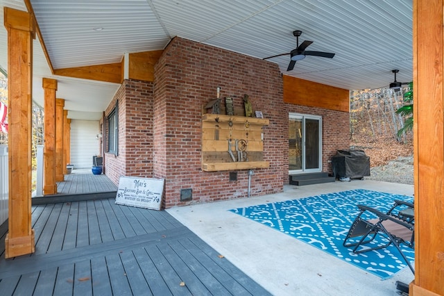 deck featuring area for grilling and ceiling fan