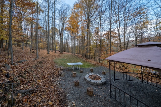 view of yard with a fire pit