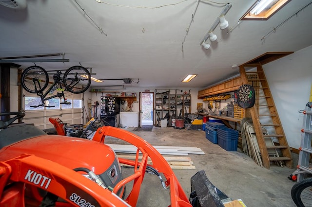 garage featuring a workshop area and a garage door opener