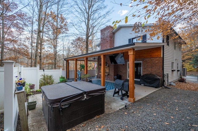 view of patio / terrace featuring a hot tub