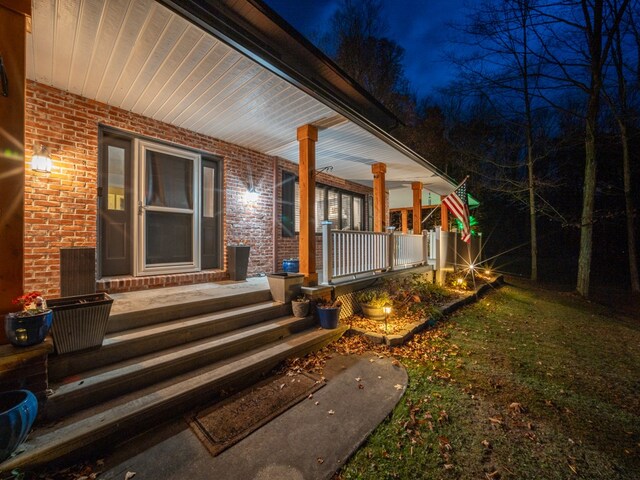 doorway to property with a porch