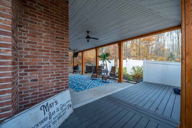 wooden deck featuring ceiling fan