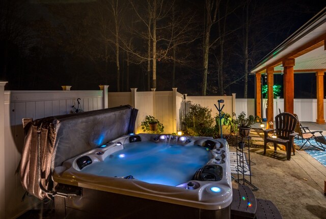 view of patio / terrace with a hot tub