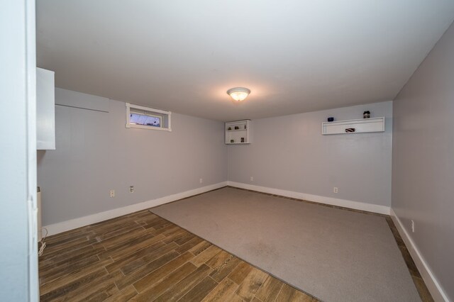 basement with dark wood-type flooring