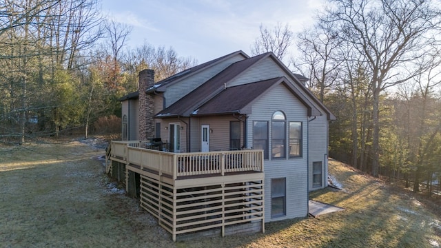 rear view of property with a deck