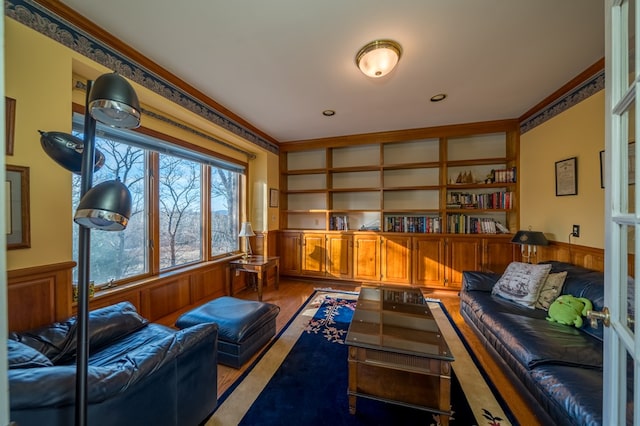 interior space featuring built in shelves and wooden walls