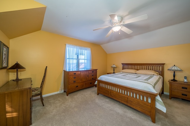 carpeted bedroom with vaulted ceiling and ceiling fan