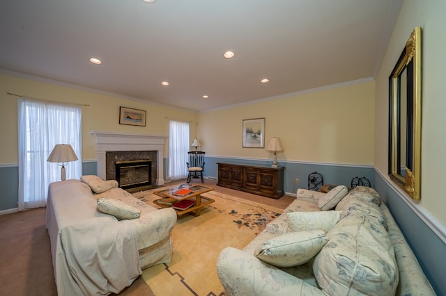 carpeted living room featuring a premium fireplace and crown molding