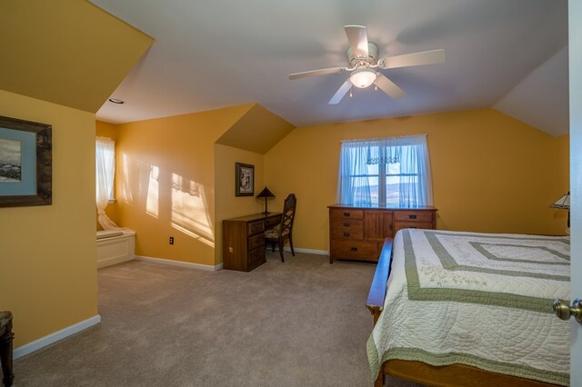 bedroom with lofted ceiling, light carpet, and ceiling fan