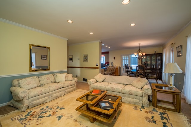 carpeted living room with crown molding and a chandelier