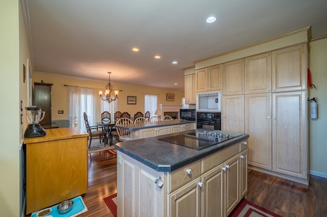 kitchen featuring decorative light fixtures, black appliances, dark hardwood / wood-style floors, and a kitchen island