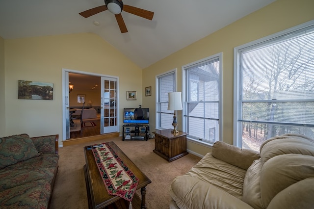 carpeted living room with lofted ceiling and ceiling fan