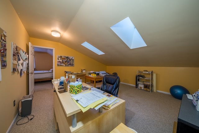 office area with carpet flooring and lofted ceiling with skylight