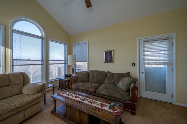 living room with lofted ceiling, light colored carpet, and ceiling fan