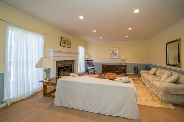 carpeted living room featuring crown molding, plenty of natural light, and a premium fireplace