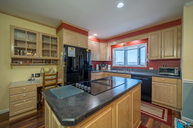 kitchen featuring sink, built in desk, black appliances, a kitchen island, and dark hardwood / wood-style flooring