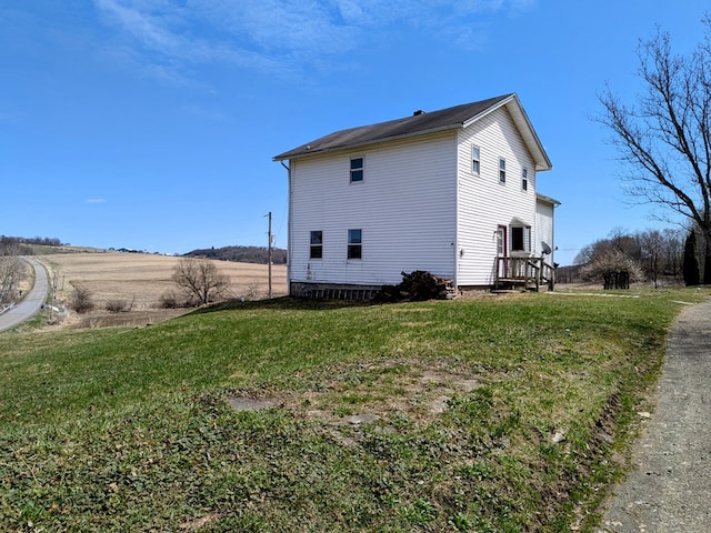 view of property exterior featuring a yard
