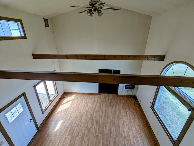 interior space with wood finished floors and ceiling fan