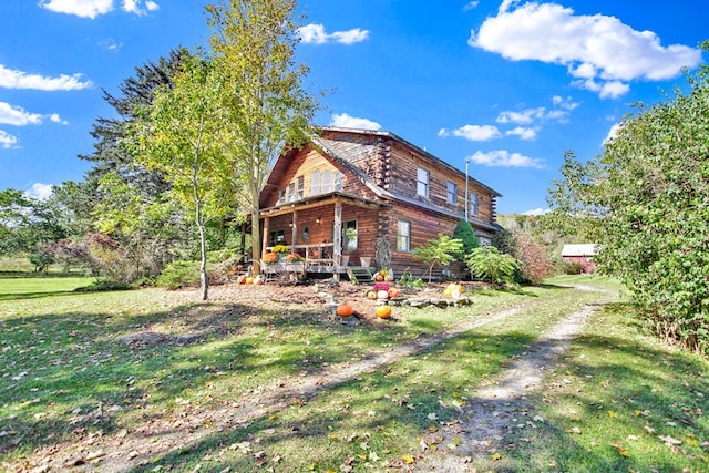 20 Mill Creek Rd, Mansfield, PA 16933 - rear view of house with log siding, a wooden deck, and a lawn