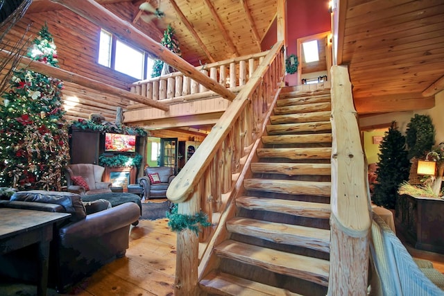 20 Mill Creek Rd, Mansfield, PA 16933 - stairway with wooden ceiling with exposed beams, high vaulted ceiling, hardwood / wood-style flooring, healthy amount of natural light, and log walls
