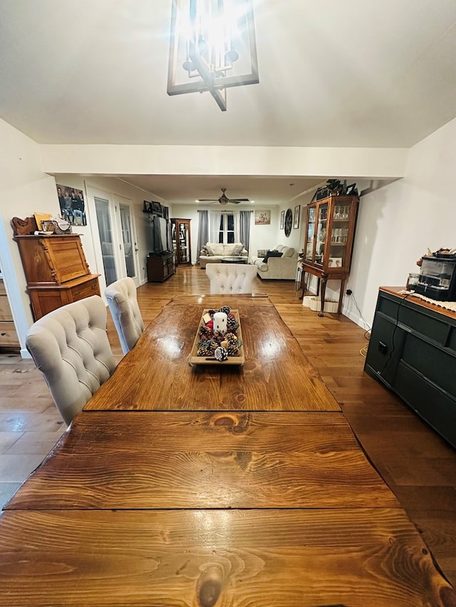 dining area with ceiling fan and hardwood / wood-style floors