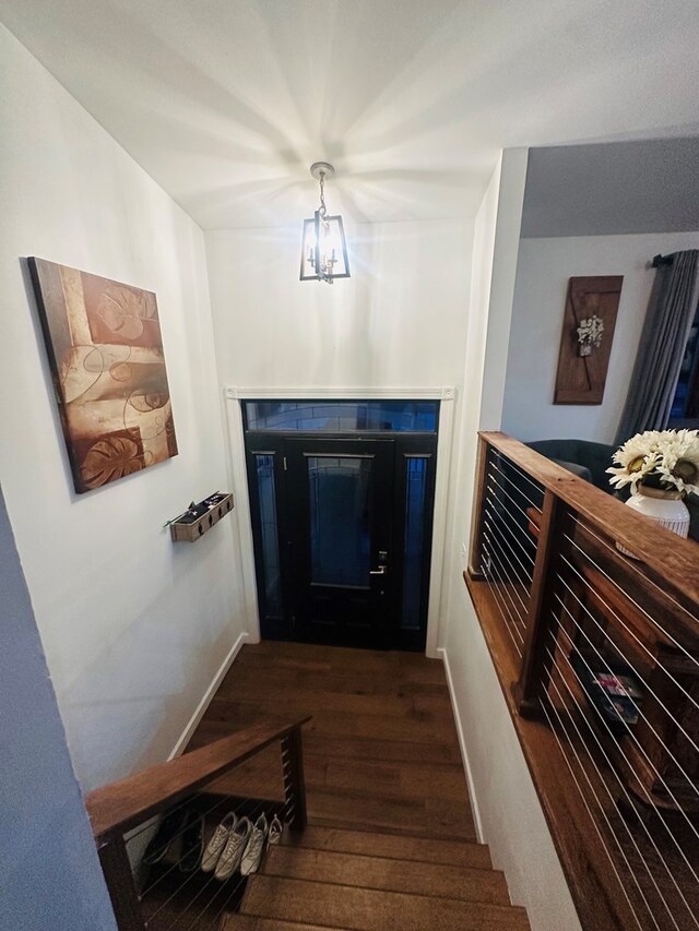 stairs featuring hardwood / wood-style floors