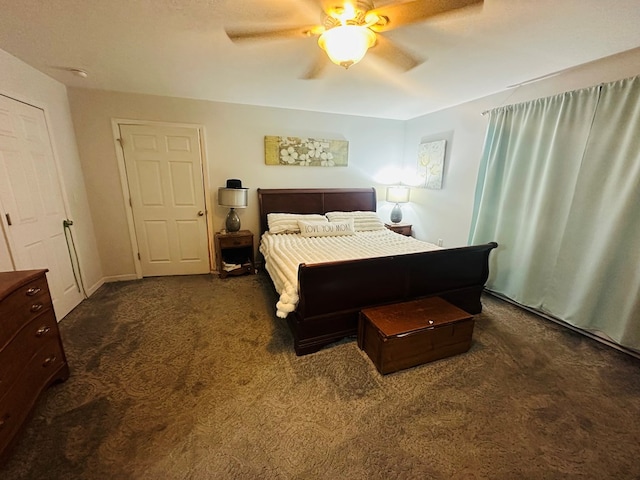 bedroom featuring a ceiling fan and dark carpet