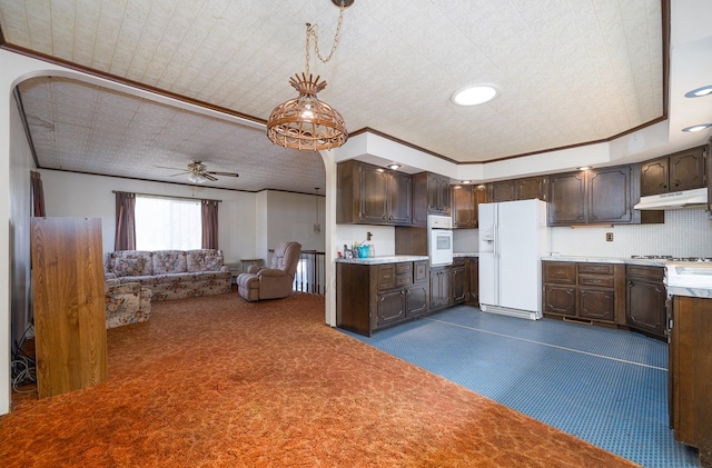 56 Benson Ave, Mansfield, PA 16933 - kitchen featuring light countertops, crown molding, white appliances, under cabinet range hood, and dark brown cabinetry