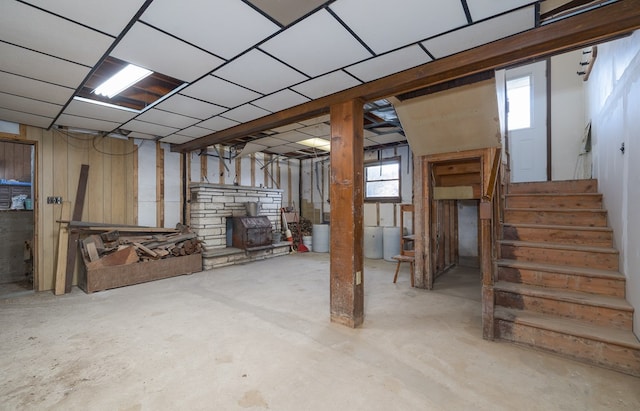 56 Benson Ave, Mansfield, PA 16933 - basement with a drop ceiling, stairs, and a wood stove