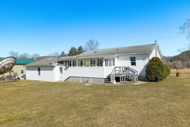 56 Benson Ave, Mansfield, PA 16933 - rear view of property featuring a sunroom, a shingled roof, and a lawn