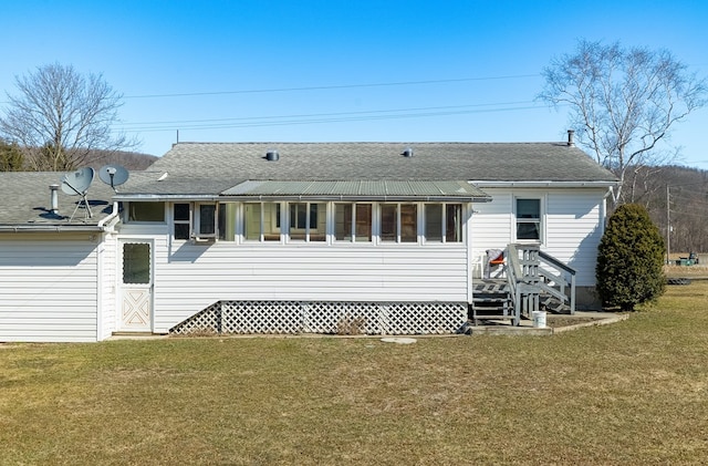 56 Benson Ave, Mansfield, PA 16933 - rear view of house with roof with shingles and a yard