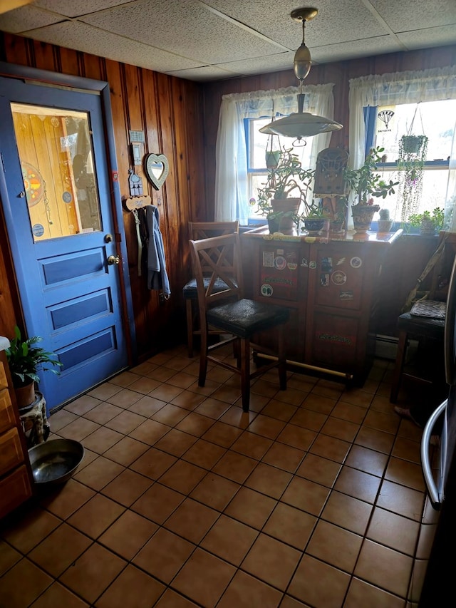 88 Finkenbinder Rd, Spencer, NY 14883 - dining room featuring a drop ceiling and wood walls